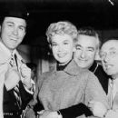 Doris Day being embraced by director Charles Vidor